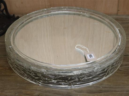 A 1970s circular perspex mirror W.48.5cm